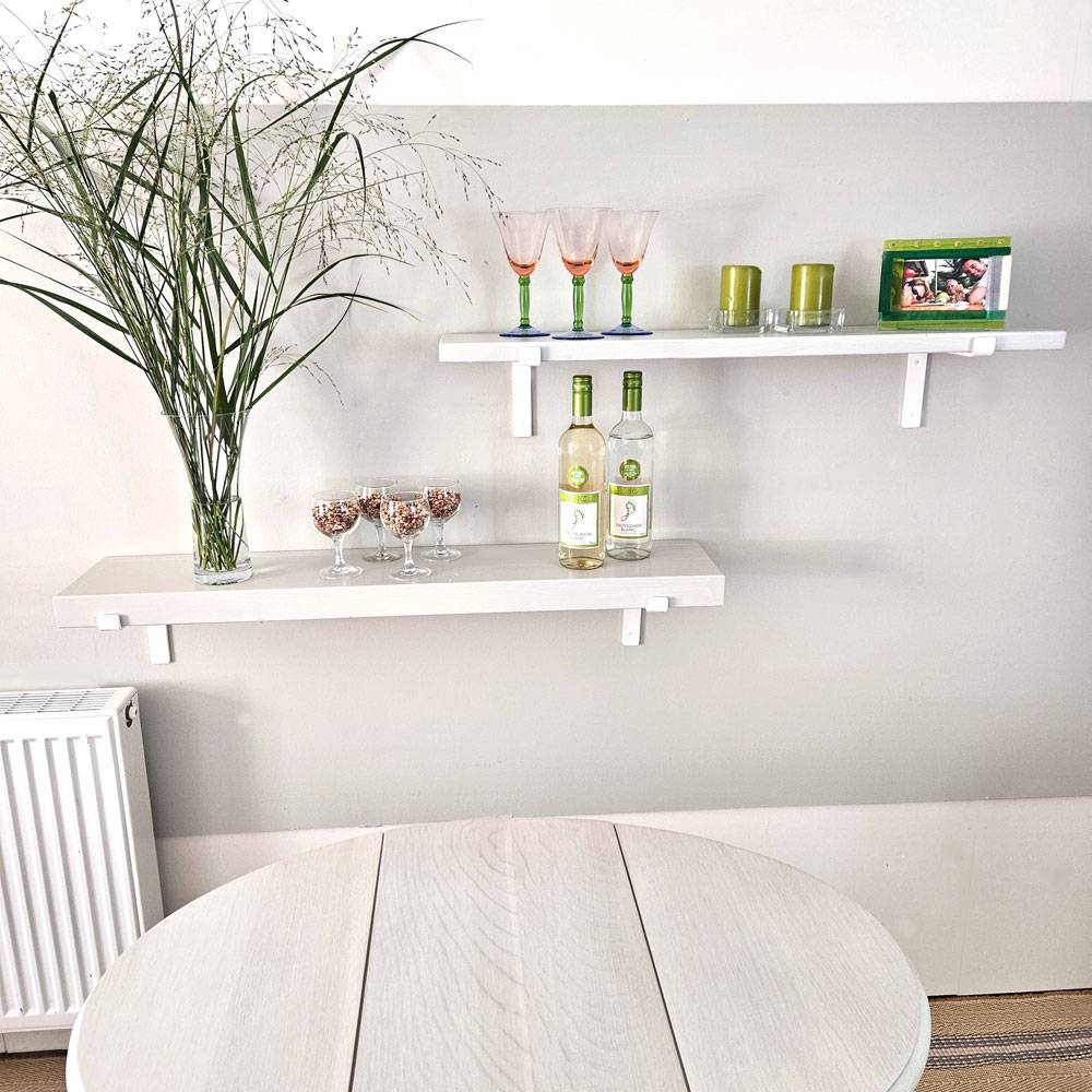 White Painted Wood Shelves with down white down brackets.